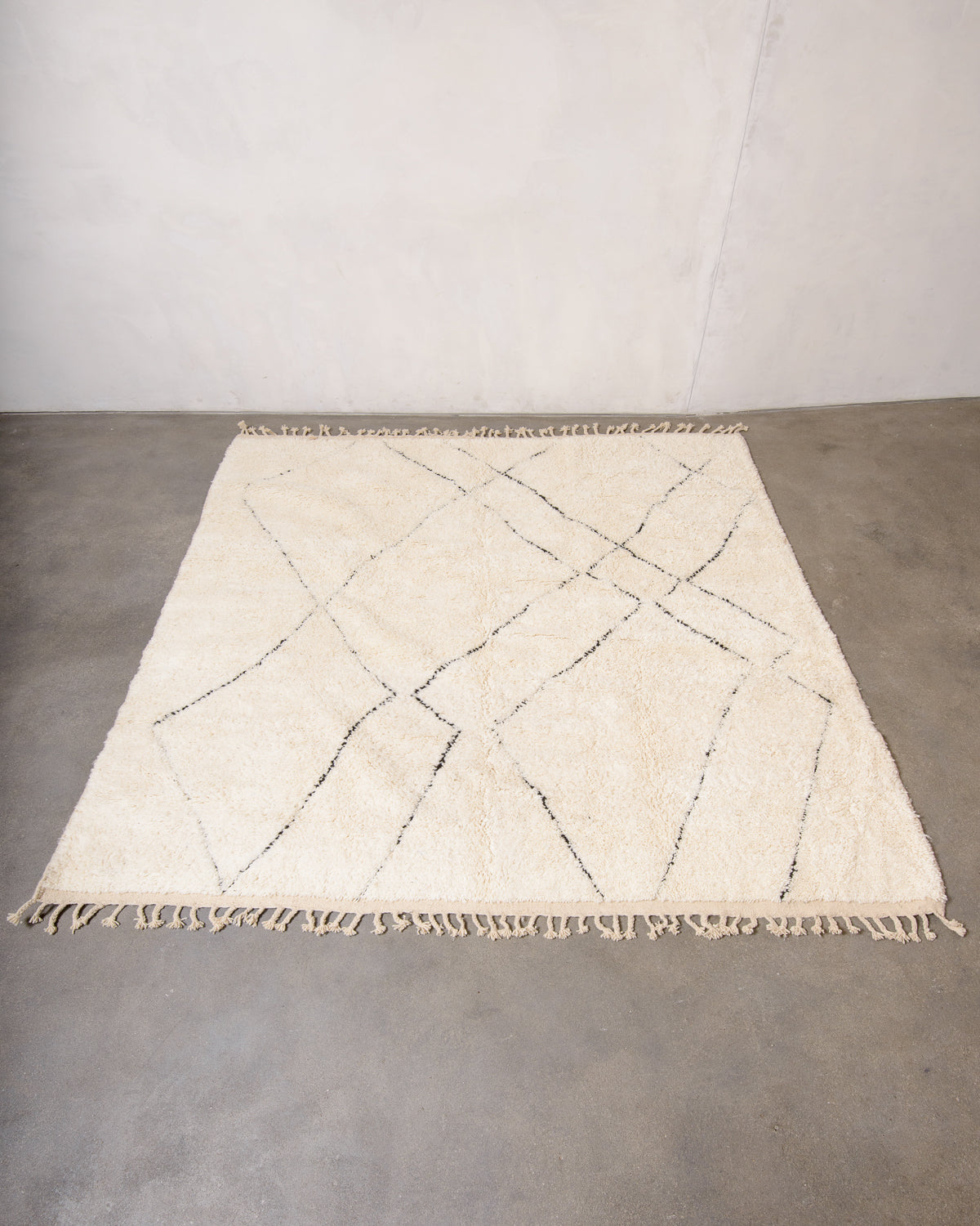 Modern, designer, handcrafted Berber rug from Morocco. Beniourain carpet with minimalist design, natural wool pile and a fluffy texture.